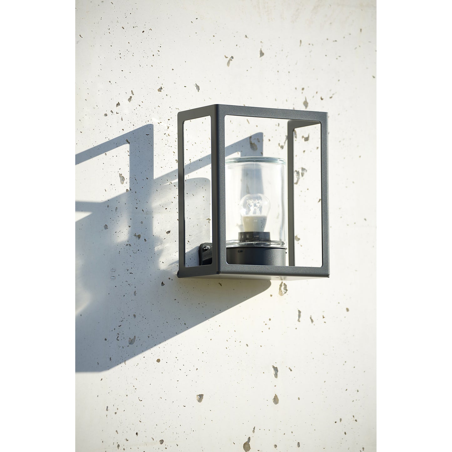 Hugy Clear Glass Decorative Multi-Position Light with Cut-Out and bent Aluminium Body