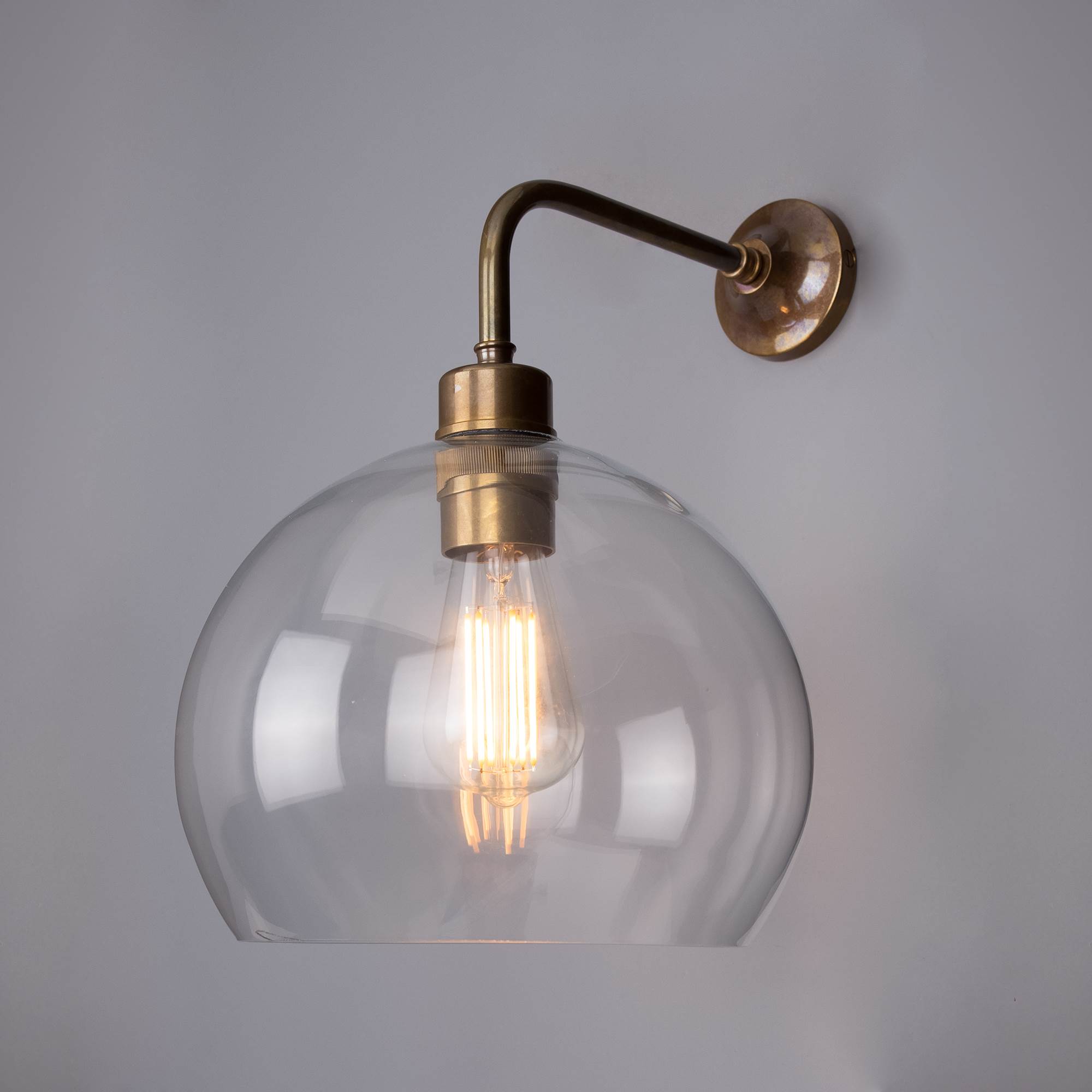 Mullan Lighting Eden 25cm Clear Glass Wall Light with Globe Glass - Antique  Brass
